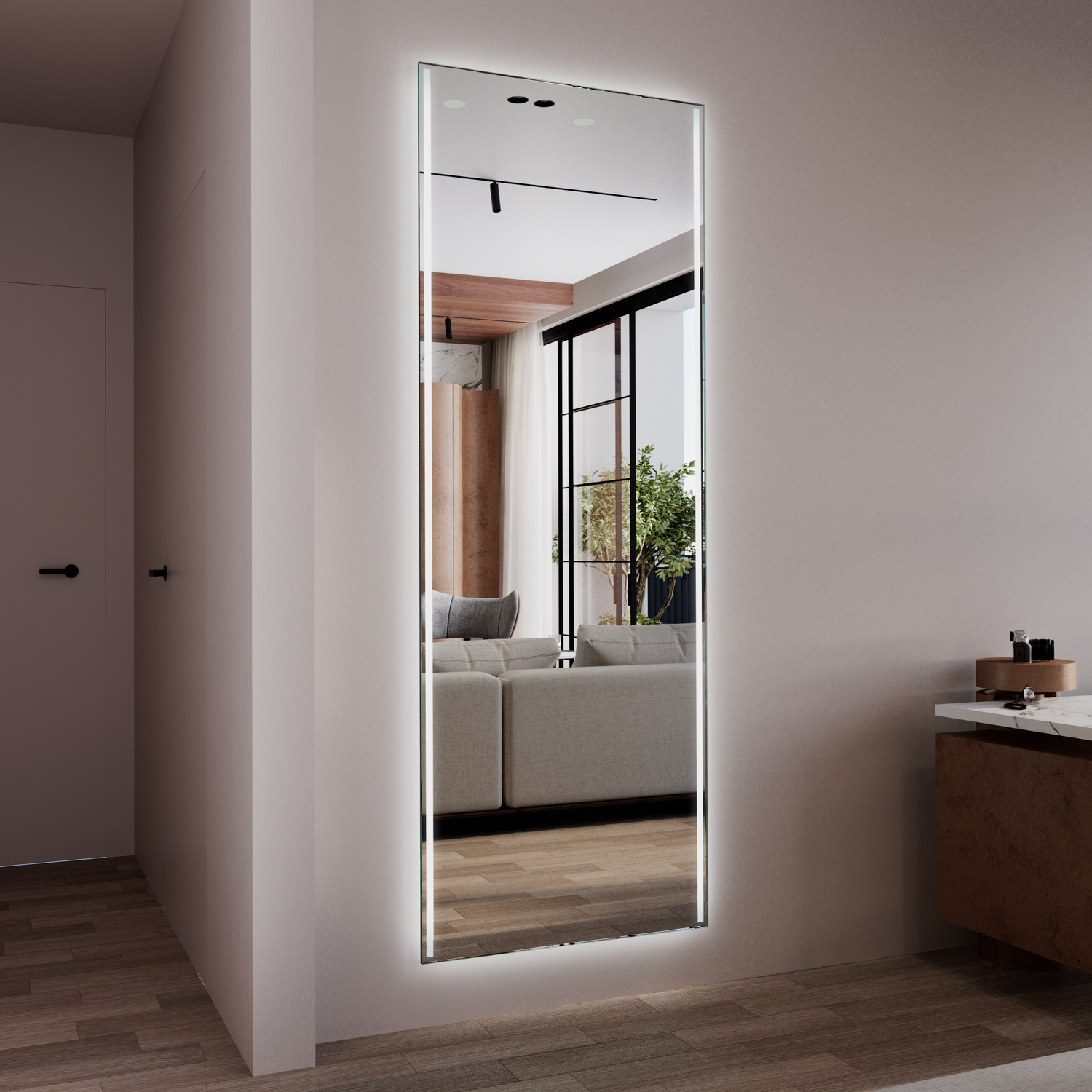 Wandspiegel BARI mit eingeschalteter LED-Hintergrundbeleuchtung, Seitenansicht, hoher rechteckiger Ganzkörperspiegel mit weißem Rahmen, freistehend an rosafarbener Wand, Spiegelung zeigt Wohnbereich mit Fenster, Grünpflanze, modern