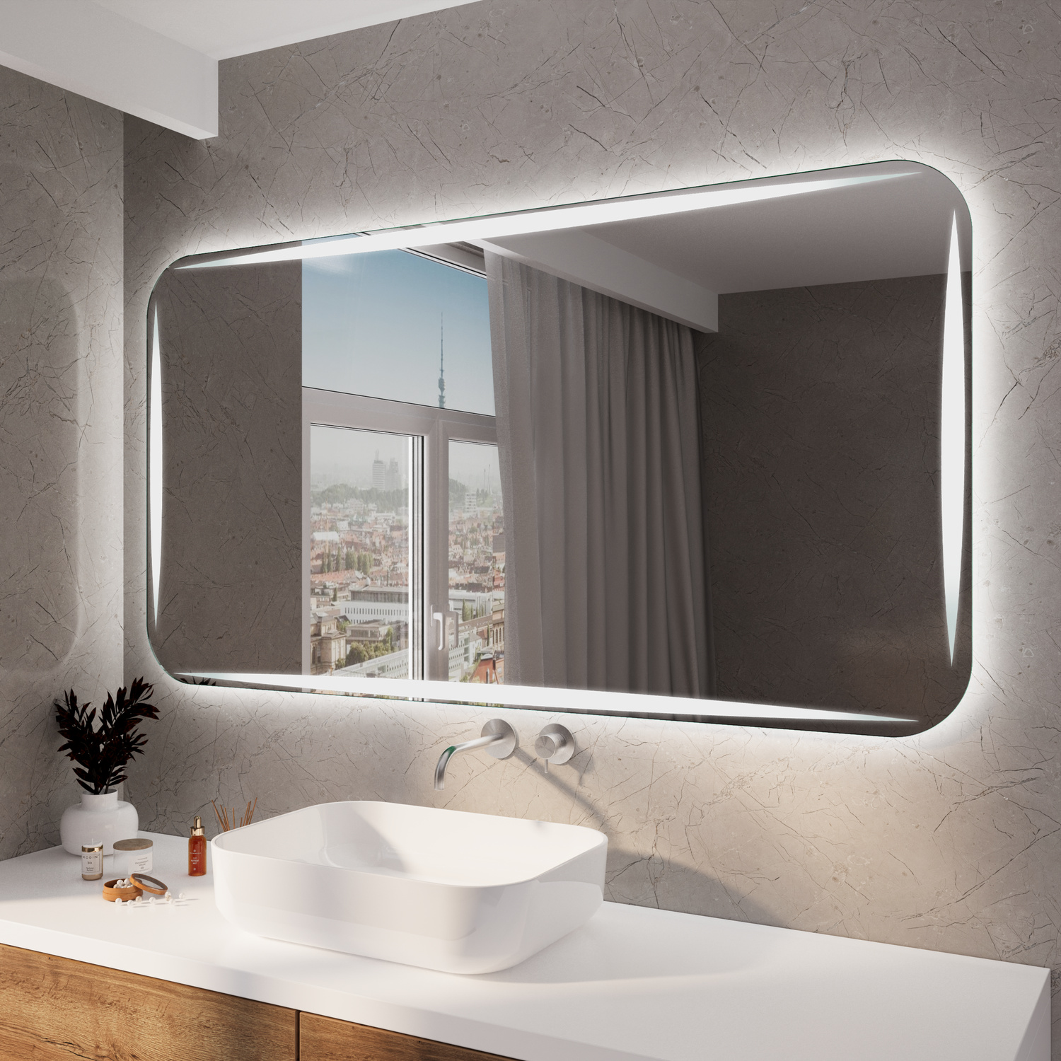 CORIA RAD LED-Badspiegel mit eingeschalteter Beleuchtung, 1500x1500 mm, warmweißes Licht im silbernen Rahmen, abgerundete Ecken, über weißem Waschtisch mit ovalem Aufsatzwaschbecken, modernes Bad mit anthrazitfarbener Wand und Stadtblick