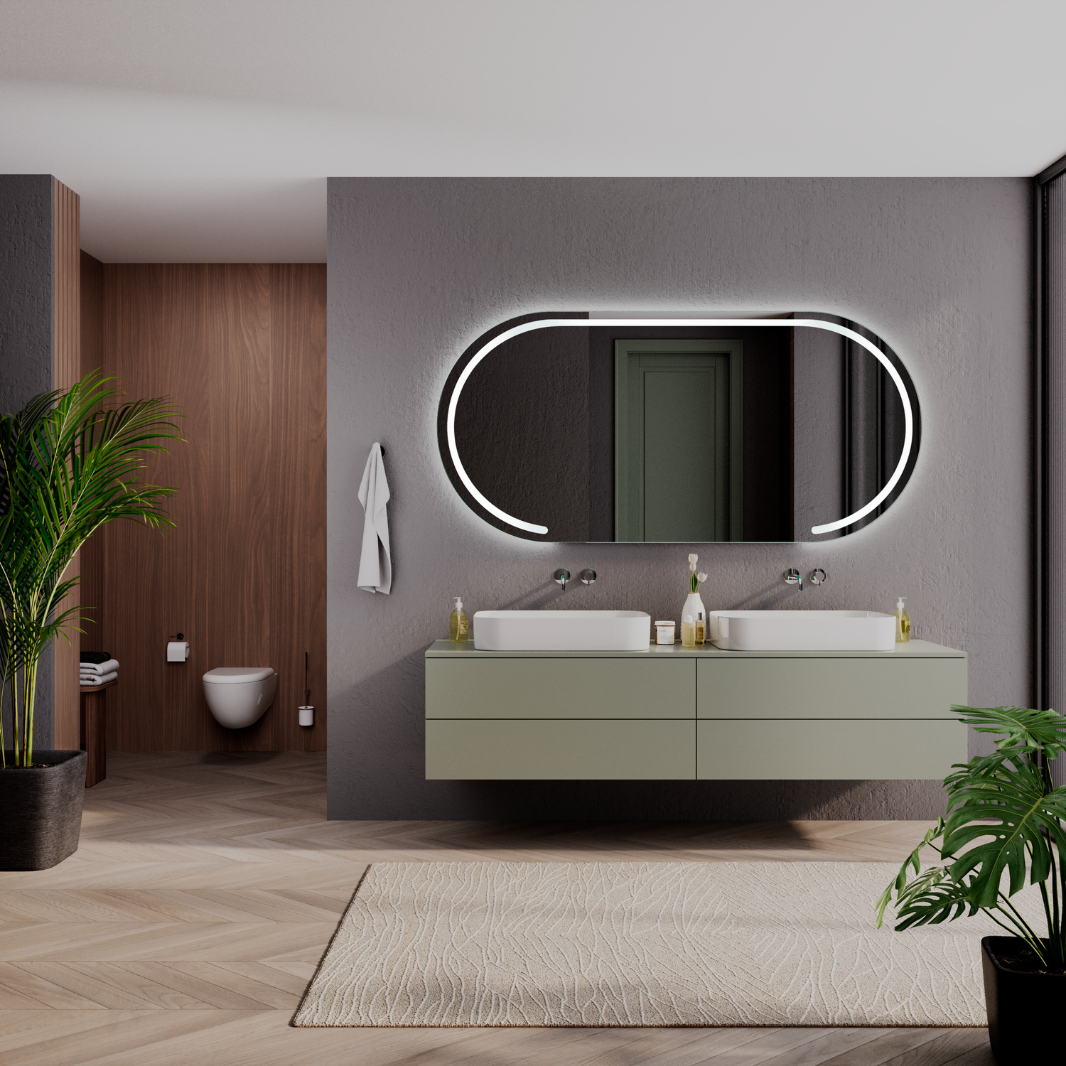 HOLGA OV LED-Badspiegel mit eingeschalteter Beleuchtung, 1500x1500 mm, ovale Form mit geteilter Spiegelfläche und leuchtendem LED-Lichtrahmen, über zwei weißen rechteckigen Aufsatzwaschbecken auf grünem schwebenden Waschtisch, dunkelgraue Wand, modernes B