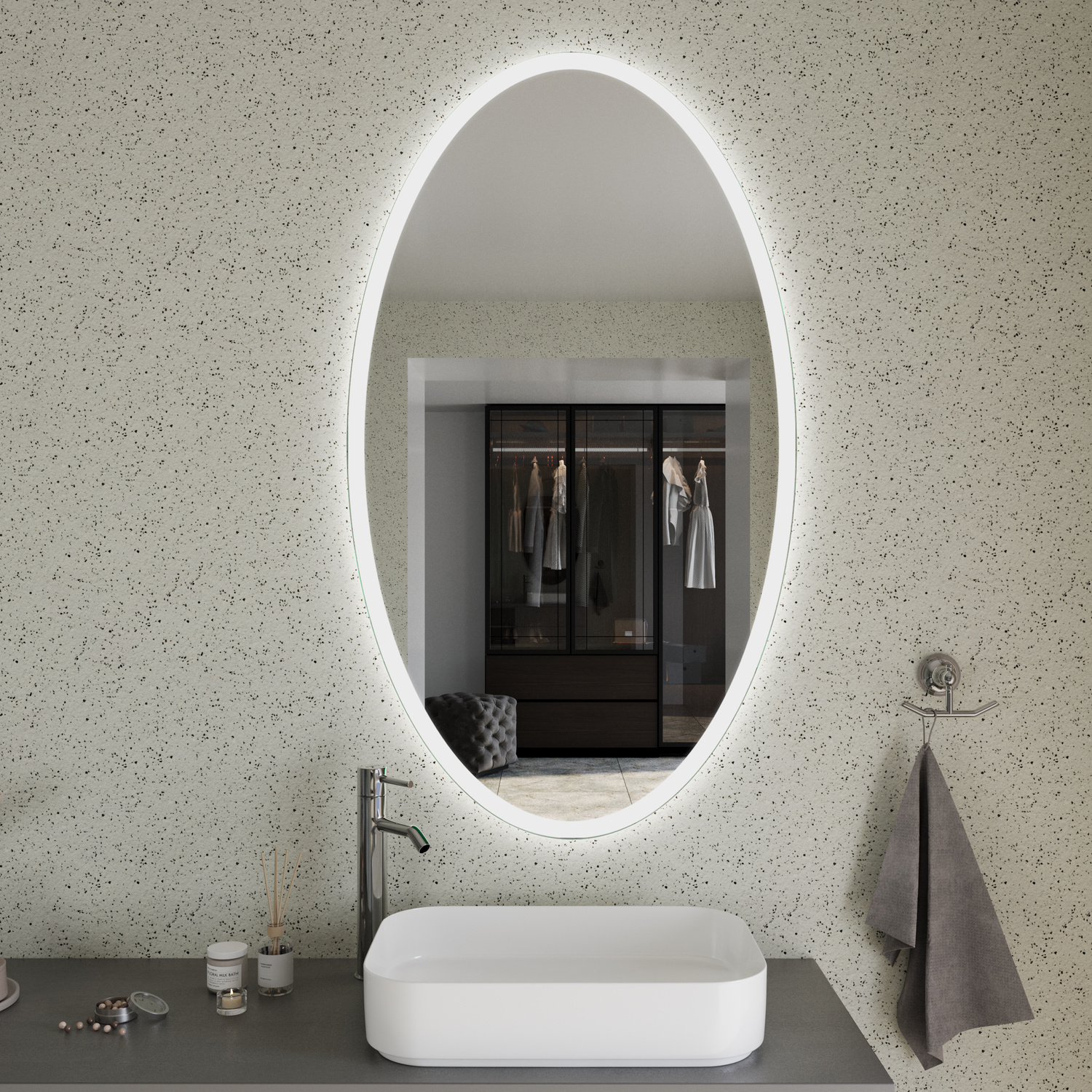 SETE EL20 ovaler LED-Badspiegel mit eingeschalteter Hintergrundbeleuchtung in Nahaufnahme, 1500x1500 mm, leuchtender warmweißer Lichtrahmen, über weißem rechteckigem Aufsatzwaschbecken auf grauer Waschtischplatte, minimalistisches Bad mit Terrazzo-Wand