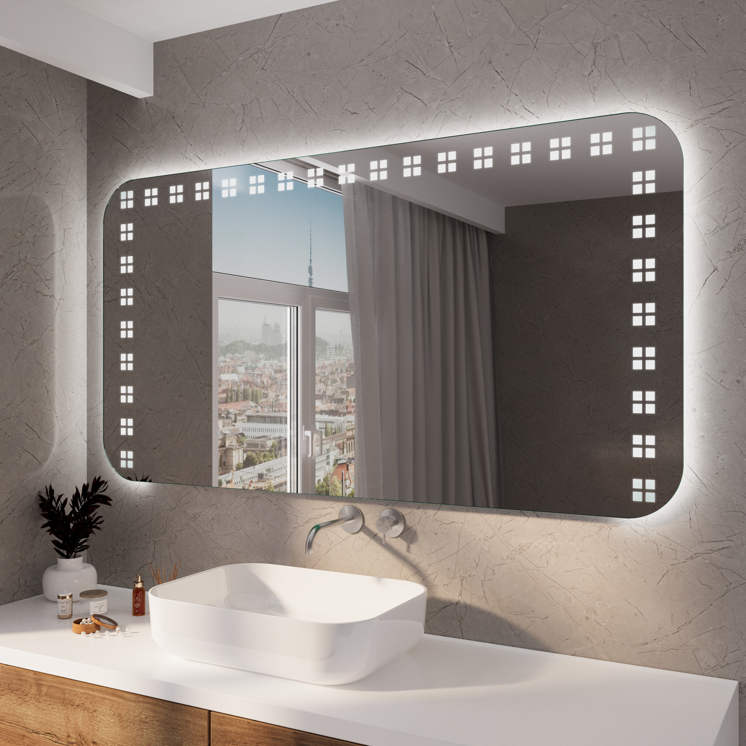 BEJAR RAD LED-Badspiegel mit eingeschalteter Beleuchtung, 1500x1500 mm, rechteckig mit abgerundeten Ecken und leuchtendem umlaufendem LED-Punkterahmen, über weißem rundem Aufsatzwaschbecken auf weißem Waschtisch, graue Wand, Fenster mit Stadtblick, Armatu