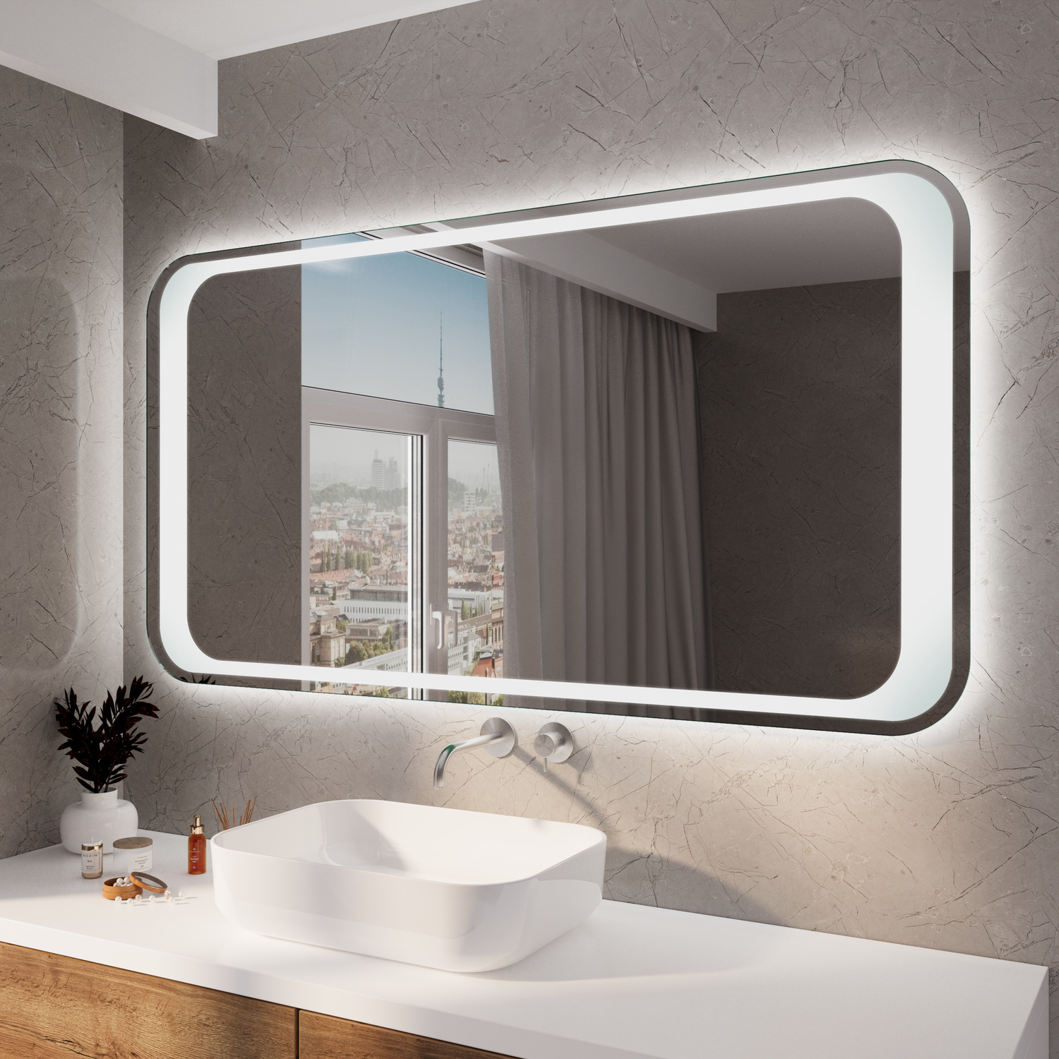 ALVADOS RAD LED-Badspiegel mit eingeschalteter Beleuchtung, 1500x1500 mm, warmweißes Licht im silbernen Rahmen, abgerundete Ecken, über weißem Waschtisch mit ovalem Aufsatzwaschbecken, modernes Bad mit anthrazitfarbener Wand und Stadtblick