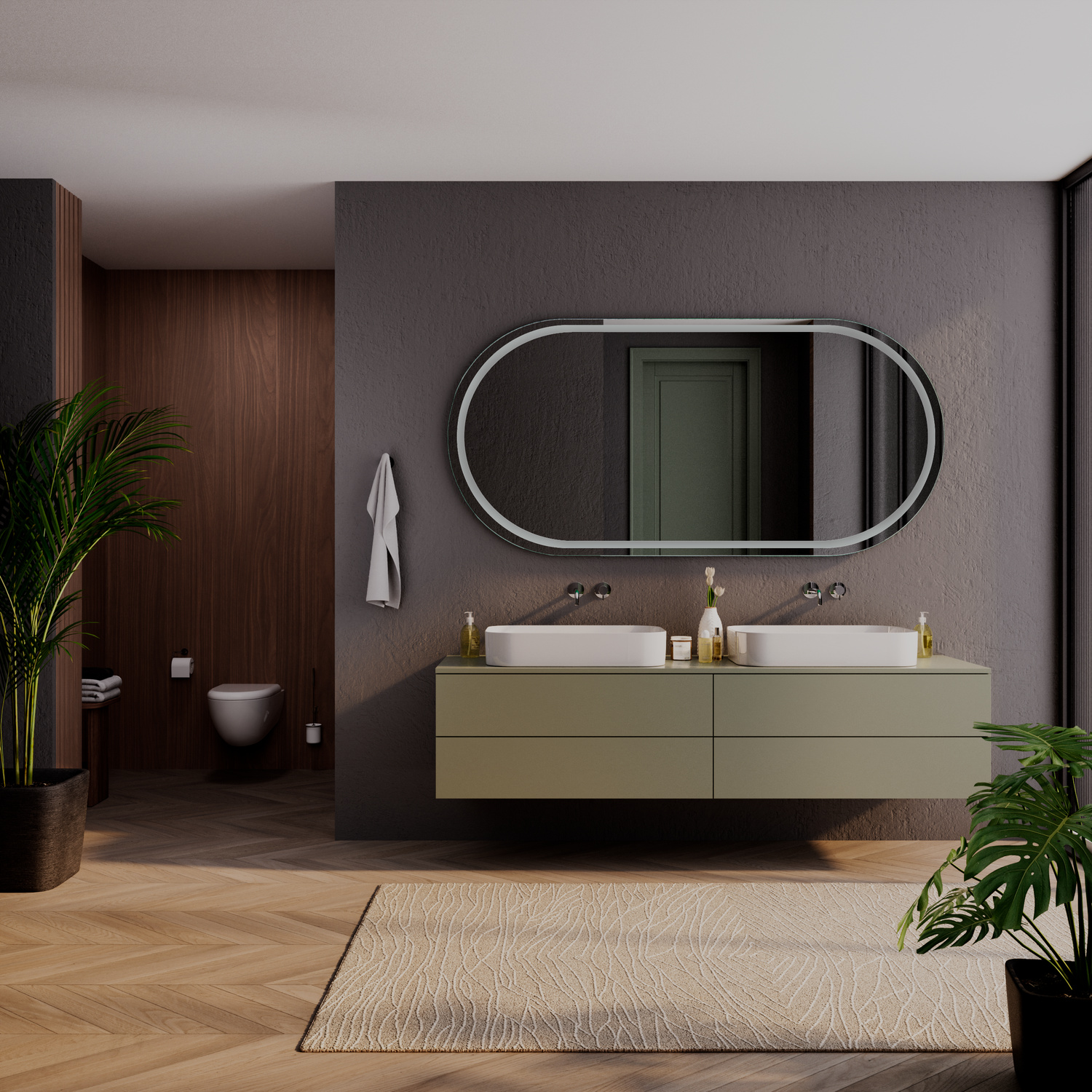 Wandspiegel TOULON OV ohne Beleuchtung, ovale Form mit dunklem Rahmen, über olivgrünem schwebendem Waschtisch mit zwei weißen rechteckigen Aufsatzwaschbecken, dunkelgraue Wand, beige Badematte, Grünpflanzen, modernes Badezimmer