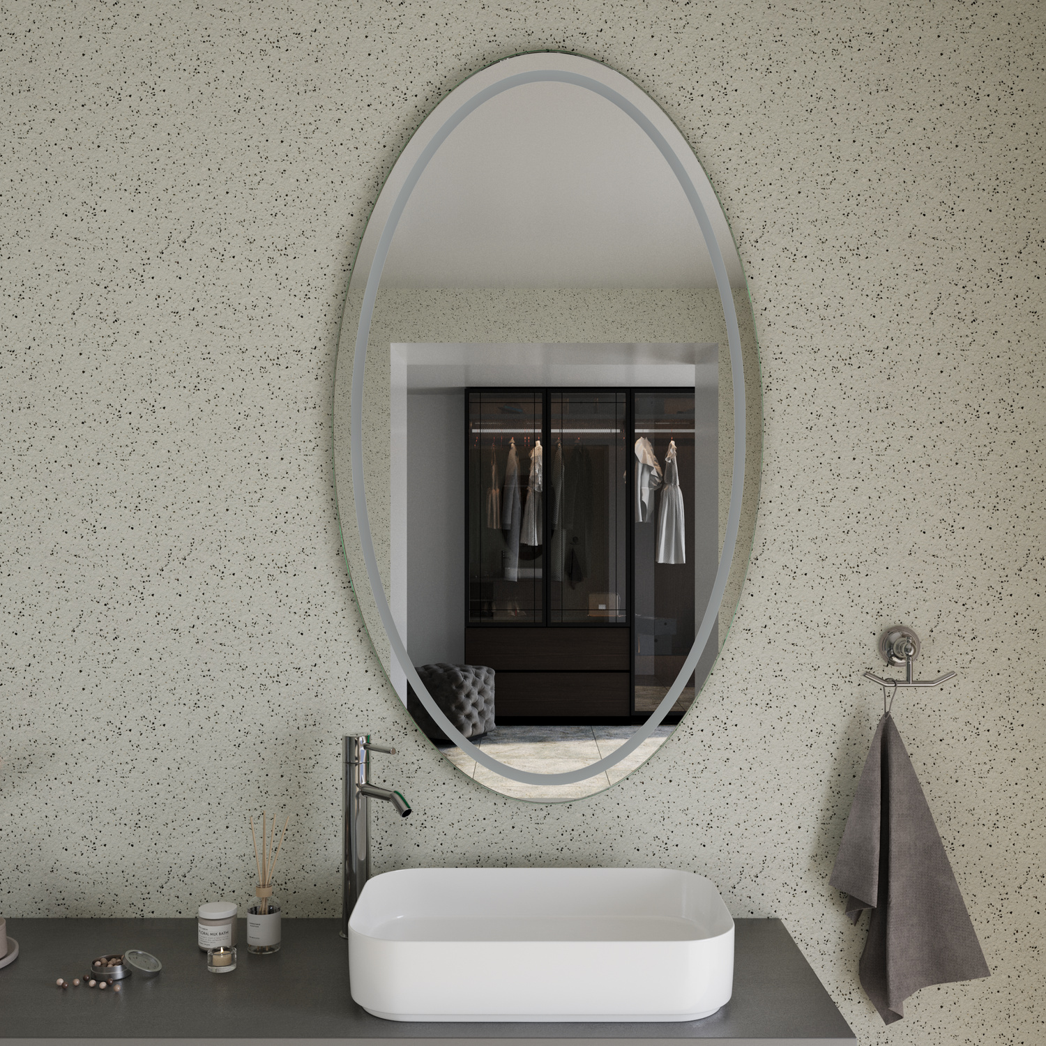ADEO EL ovaler LED-Badspiegel mit weißem Rahmen, 1500x1500 mm, Beleuchtung ausgeschaltet, über schwarzem Waschtisch mit weißem ovalem Aufsatzwaschbecken, modernes Bad mit weißer Terrazzo-Wand, graue Handtücher rechts, minimalistisch