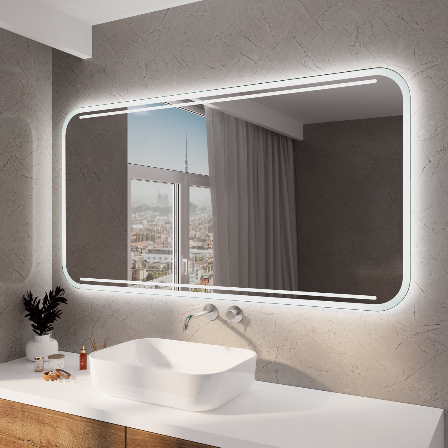 CALLAC RAD Wandspiegel mit umlaufender LED-Beleuchtung und abgerundeten Ecken, Frontalansicht, ovales weißes Aufsatzwaschbecken auf weißem Waschtisch, wandmontierte Chrom-Armatur, dunkelgraue Wand, Stadtblick durch Fenster